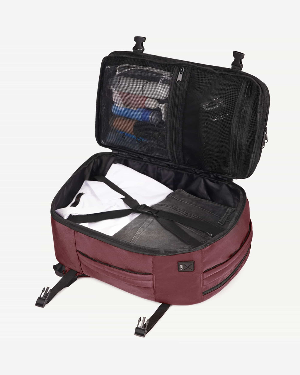 Red carry-on travel backpack open with packed interior