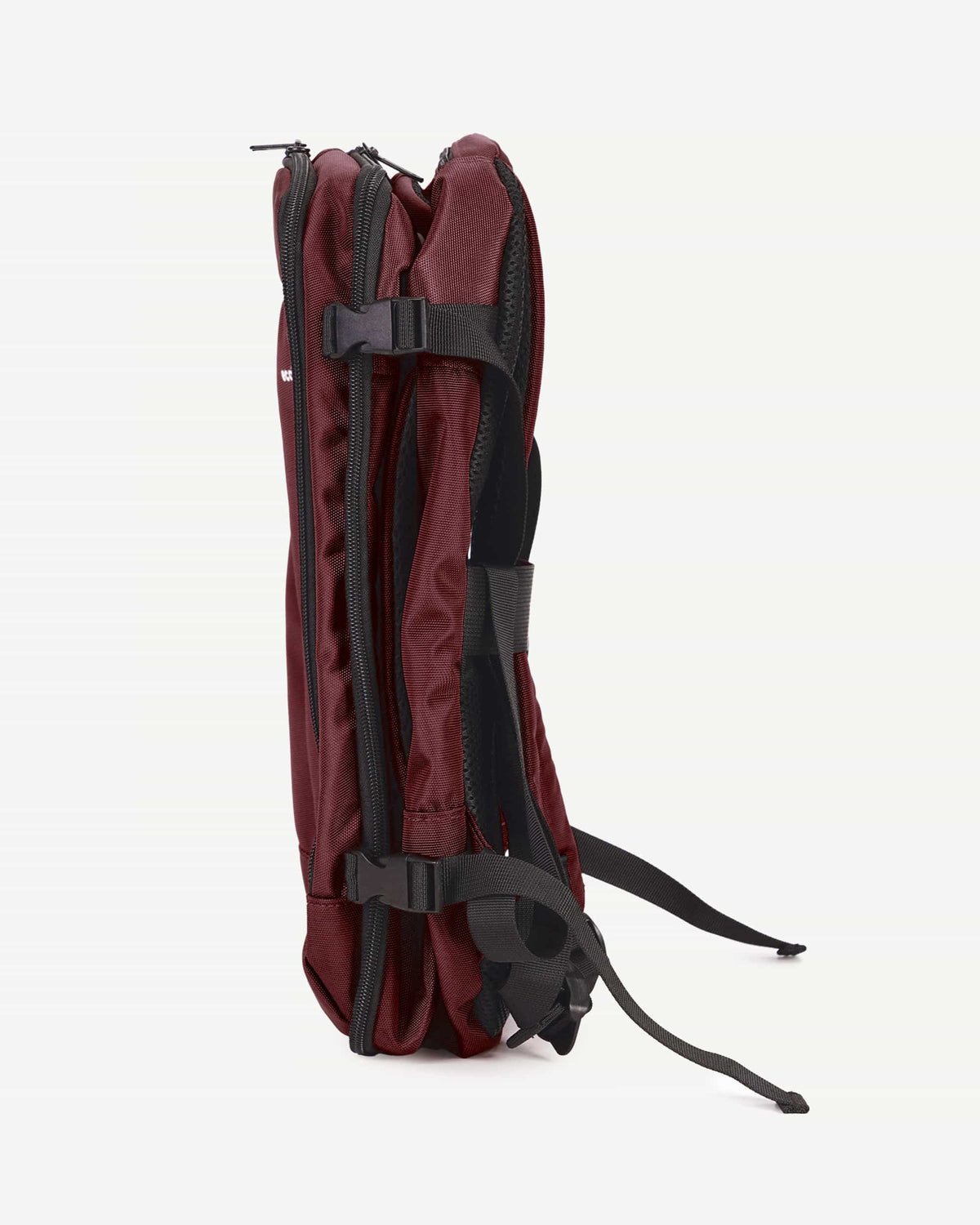 Red carry-on travel backpack side profile