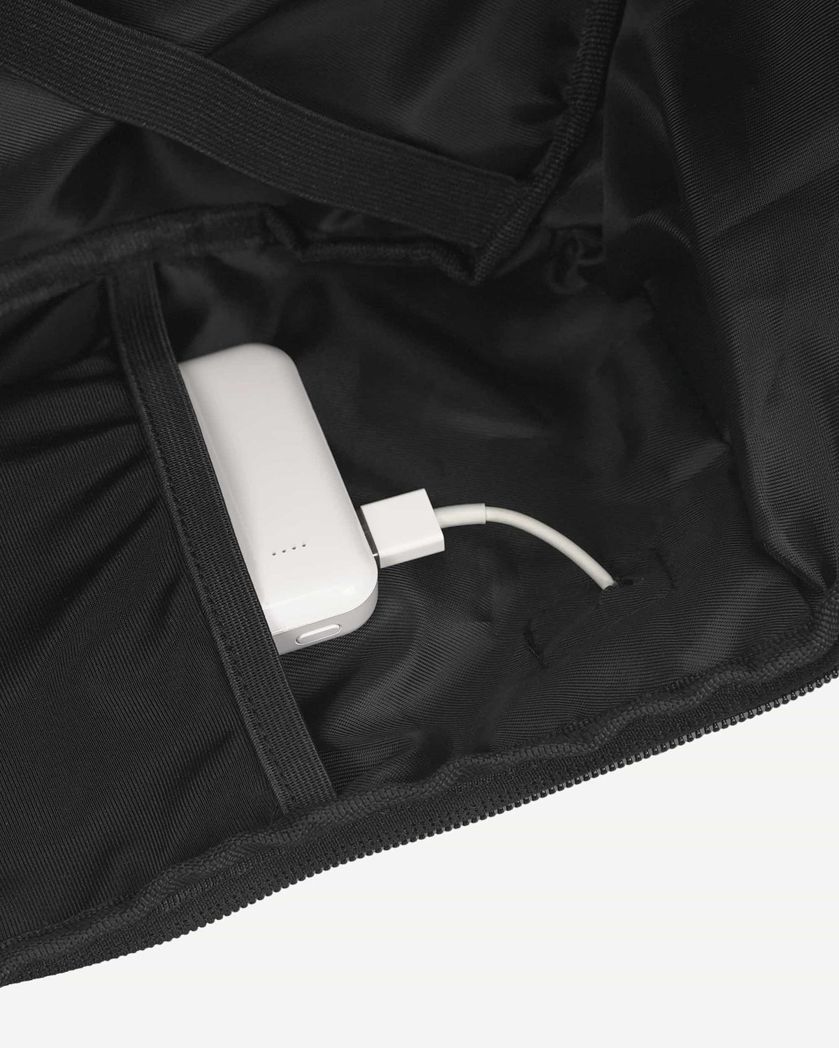 Black carry-on travel backpack zipper detail