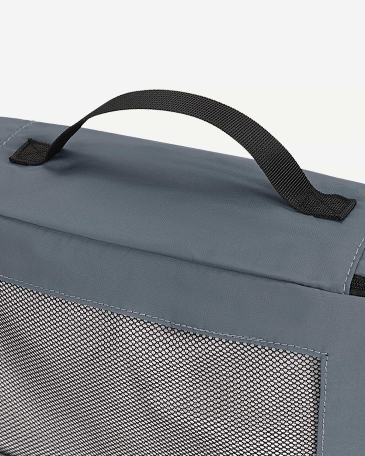 Grey packing cubes arranged as suitcase organizers