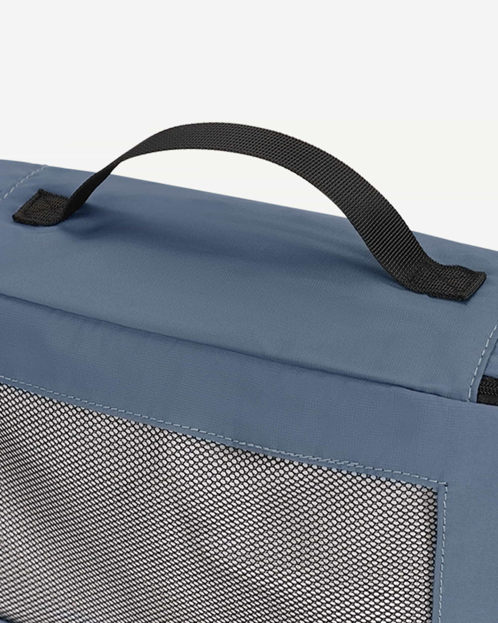 Blue packing cubes arranged as suitcase organizers